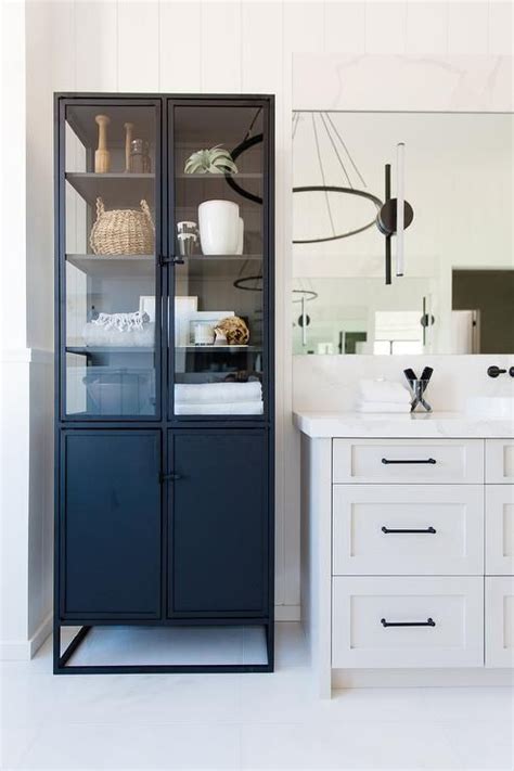 glass and steel linen cabinet|linen closet with glass doors.